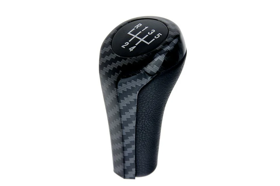 ΠΟΜΟΛΟ ΤΑΧΥΤΗΤΩΝ ΜΑΡΚΕ ΓΙΑ BMW E46/E60/E61/E62/ E63/E90/E91/E92/X1/X3/X5 CARBON ΜΕ ΕΝΔΕΙΞΗ 5 ΤΑΧΥΤΗΤΩΝ NTY ΠΟΜΟΛΟ ΤΑΧΥΤΗΤΩΝ ΜΑΡΚΕ ΓΙΑ BMW E46/E60/E61/E62/ E63/E90/E91/E92/X1/X3/X5 CARBON ΜΕ ΕΝΔΕΙΞΗ 5 ΤΑΧΥΤΗΤΩΝ NTY GZB-BM-004 - Image 1